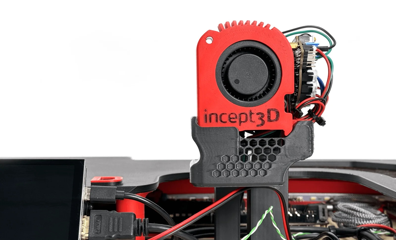 A red 3D-printed printhead with cooling fan, marked incept3D, mounted in a grey printed test-bench fixture with wiring attached