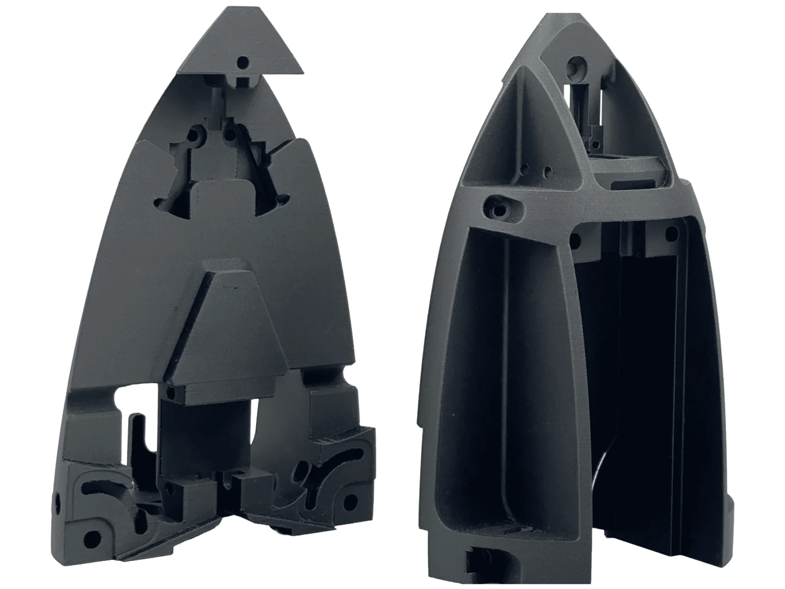 Two halves of a black 3D-printed PET-CF structural housing with internal ribbing and mounting bosses
