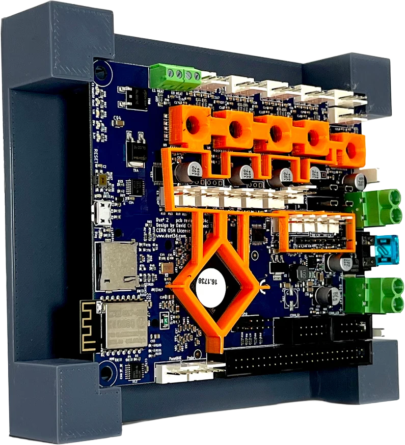 A 3D-printed grey cradle holding a circuit board, with an orange printed press jig locating components on top of it