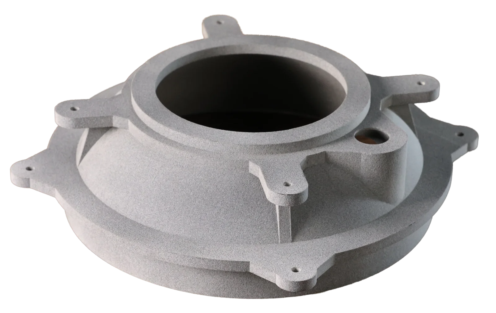 A grey 3D-printed nylon housing with a flanged base and mounting bosses, showing the grainy powder-fused surface